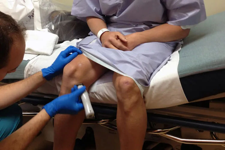 A knee being examined in clinic